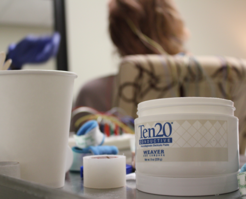 close up of lotion and water cup