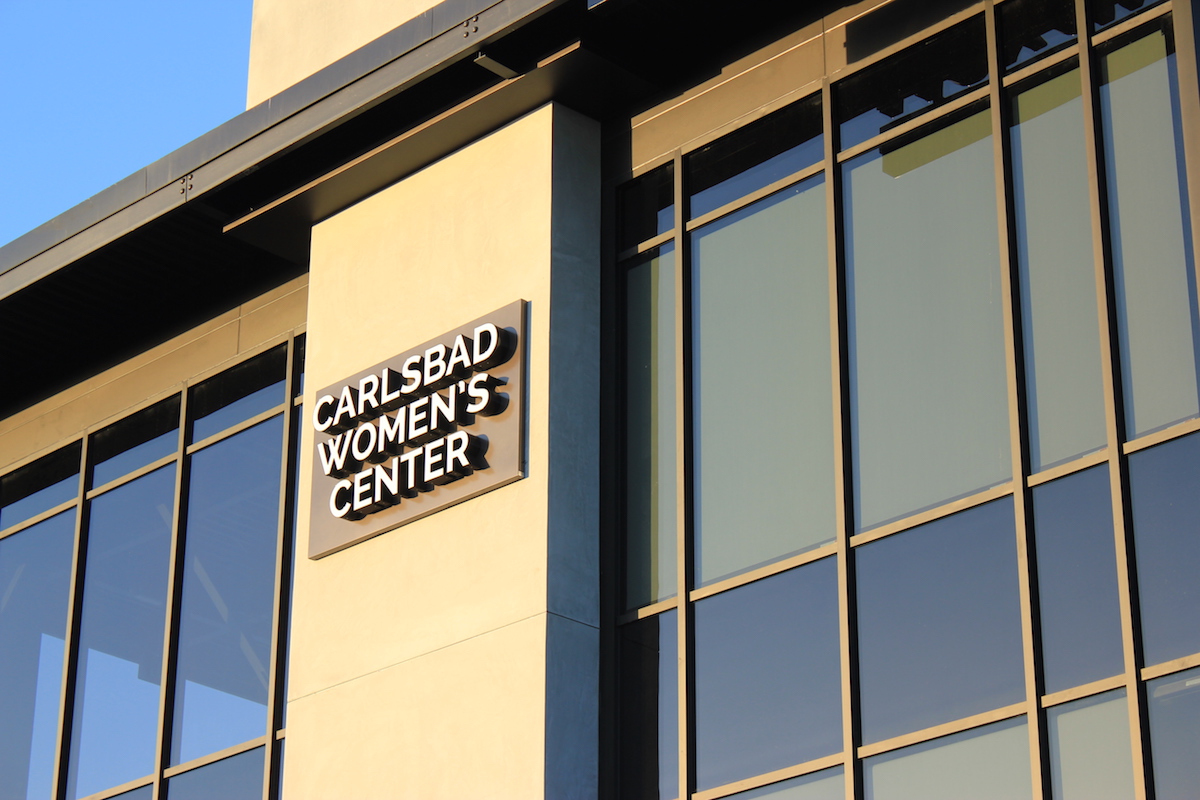 Carlsbad women center sign