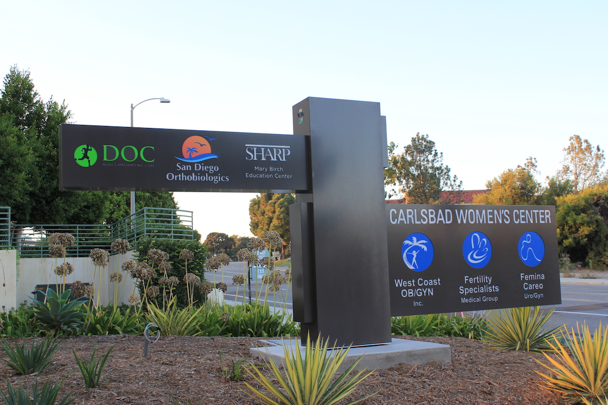 branded images on outdoor post close up