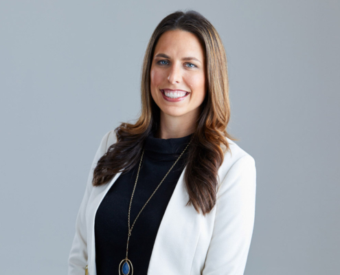 headshot of woman smiling of camera