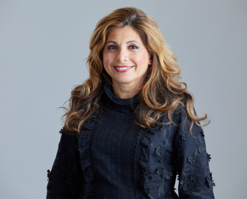 woman staring at camera and smiling