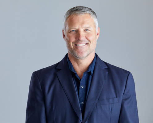 man staring at camera and smiling